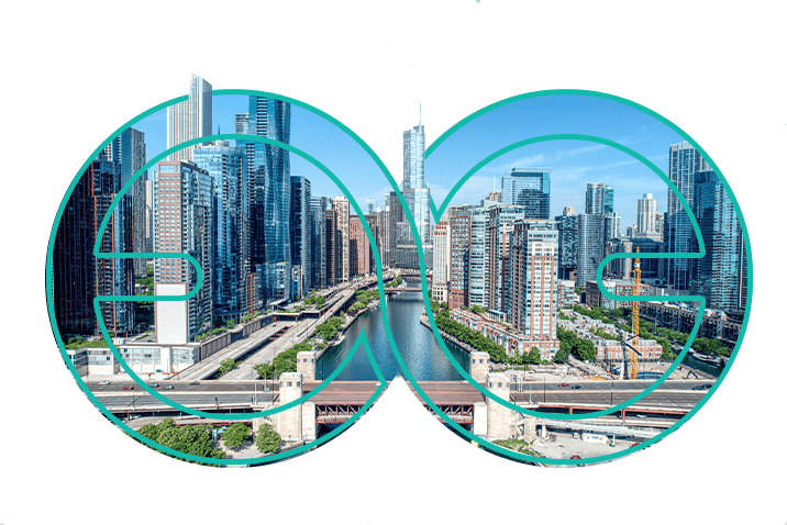 Chicago skyline with river, framed by a Veeda Logo symbol on a white background.