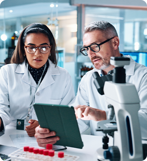 Clinical researchers using AI-powered clinical trial intelligence to analyze real-world patient data, accelerating trial execution, enrollment, and operational decisions.
